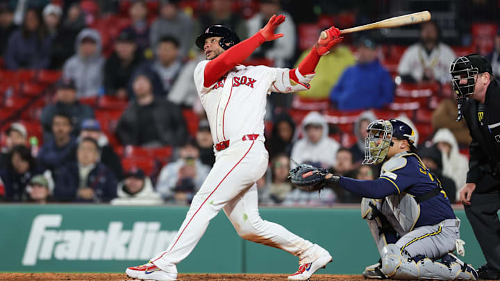Apr 6, 2026; Boston, Massachusetts, USA; Boston Red Sox catcher Willson Contreras (40) hits a home run during the ninth inning against the Milwaukee Brewers at Fenway Park. Mandatory Credit: Paul Rutherford-Imagn Images