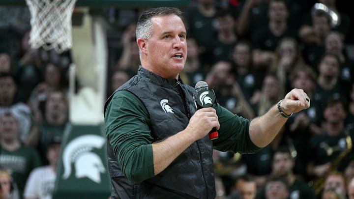 Dec 2, 2025; East Lansing, Michigan, USA;  Michigan State head football coach Pat Fitzgerald watches the Spartans defeat the Iowa Hawkeyes at Jack Breslin Student Events Center. Mandatory Credit: Dale Young-Imagn Images