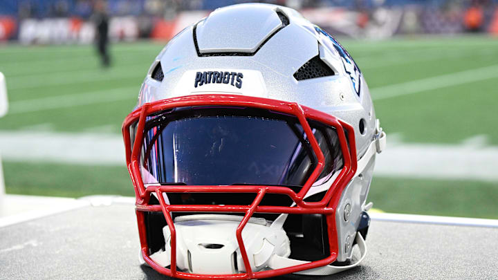 Nov 17, 2024; Foxborough, Massachusetts, USA; A New England Patriots helmet sit on an equipment case after a game against the Los Angeles Rams at Gillette Stadium. Mandatory Credit: Eric Canha-Imagn Images