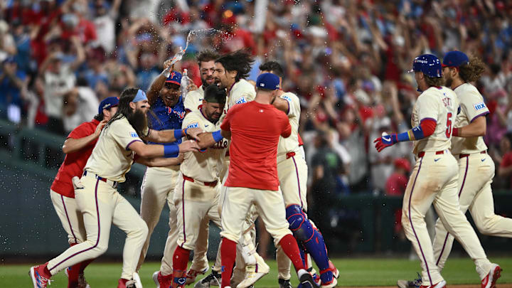 Oct 6, 2024; Philadelphia, Pennsylvania, USA; Philadelphia Phillies outfielder Nick Castellanos (8) celebrates with teammates after defeating the New York Mets during game two of the NLDS for the 2024 MLB Playoffs at Citizens Bank Park. Mandatory Credit: Kyle Ross-Imagn Images