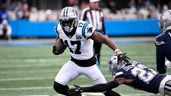 Dec 15, 2024; Charlotte, North Carolina, USA; Carolina Panthers wide receiver Xavier Legette (17) with the ball as Dallas Cowboys cornerback Amani Oruwariye (27) defefends in the first quarter at Bank of America Stadium. Mandatory Credit: Bob Donnan-Imagn Images
