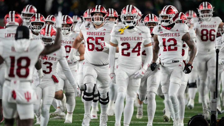 Indiana Hoosiers players enter the field for warm ups before a game between the Indiana Hoosiers and the Notre Dame Fighting Irish in first round of the College Football Playoff on Friday, Dec. 20, 2024, in South Bend.