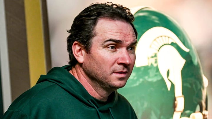 Michigan State coach Jonathan Smith takes the podium before talking to the media on the first