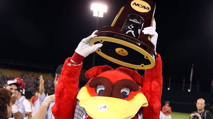South Carolina baseball mascot Cocky with the College World Series Trophy