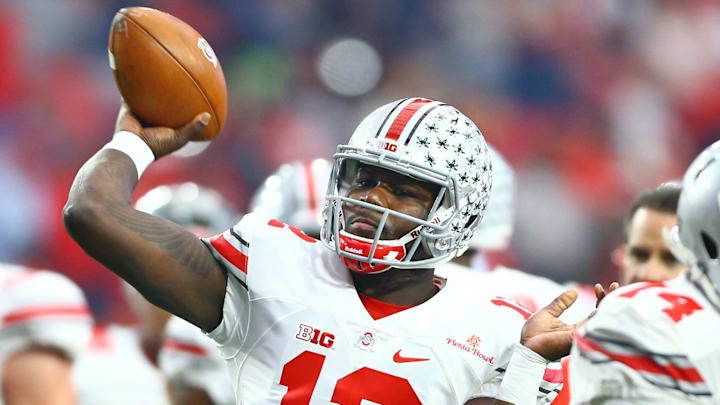 Jan 1, 2016; Glendale, AZ, USA; Ohio State Buckeyes quarterback Cardale Jones (12) against the Notre Dame Fighting Irish during the 2016 Fiesta Bowl at University of Phoenix Stadium. The Buckeyes defeated the Fighting Irish 44-28. Mandatory Credit: Mark J. Rebilas-Imagn Images