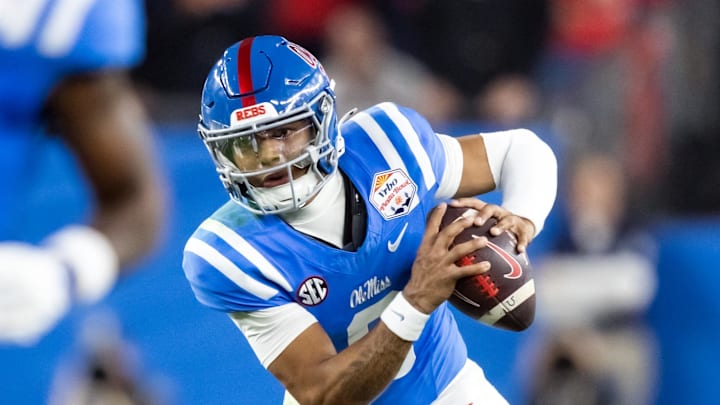 Jan 8, 2026; Glendale, AZ, USA; Mississippi Rebels quarterback Trinidad Chambliss (6) against the Miami Hurricanes during the 2026 Fiesta Bowl and semifinal game of the College Football Playoff at State Farm Stadium. Mandatory Credit: Mark J. Rebilas-Imagn Images Jan 8, 2026; Glendale, AZ, USA; Mississippi Rebels quarterback Trinidad Chambliss (6) against the Miami Hurricanes during the 2026 Fiesta Bowl and semifinal game of the College Football Playoff at State Farm Stadium. Mandatory Credit: Mark J. Rebilas-Imagn Images