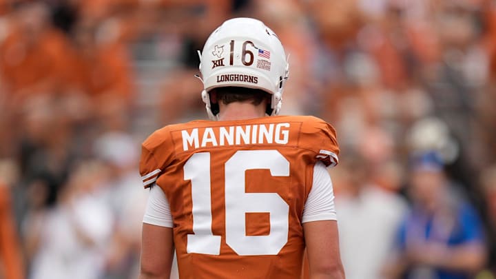 Texas Longhorns quarterback Arch Manning warms up before a college football game.