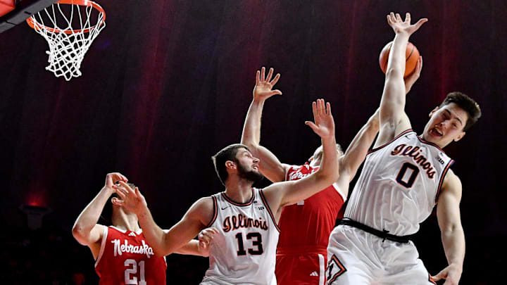 Dec 13, 2025; Champaign, Illinois, USA;  Illinois Fighting Illini forward David Mirkovic (0) and teammate Tomislav Ivisic (13) vie for a rebound during the first half against the Nebraska Cornhuskers at State Farm Center. Mandatory Credit: Ron Johnson-Imagn Images