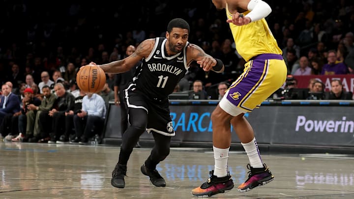 Jan 30, 2023; Brooklyn, New York, USA; Brooklyn Nets guard Kyrie Irving (11) drives to the basket against Los Angeles Lakers forward Rui Hachimura (28) during the first quarter at Barclays Center. Mandatory Credit: Brad Penner-Imagn Images