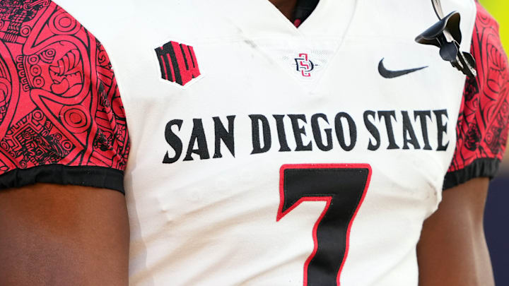 A view of the Mountain West Conference logo on the uniform of San Diego State Aztecs running back Lucky Sutton (7).