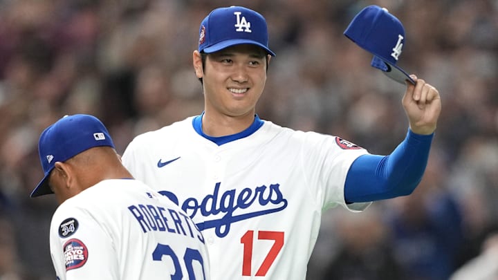 Mar 16, 2025; Bunkyo, Tokyo, Japan; Los Angeles Dodgers designated hitter Shohei Ohtani (17) gestures before the game against the Hanshin Tigers at Tokyo Dome. Mandatory Credit: Darren Yamashita-Imagn Images