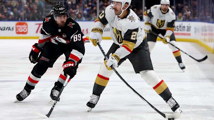 Mar 2, 2024; Buffalo, New York, USA;  Buffalo Sabres right wing Alex Tuch (89) tries to block a shot by Vegas Golden Knights center Chandler Stephenson (20) during the third period at KeyBank Center. Mandatory Credit: Timothy T. Ludwig-Imagn Images