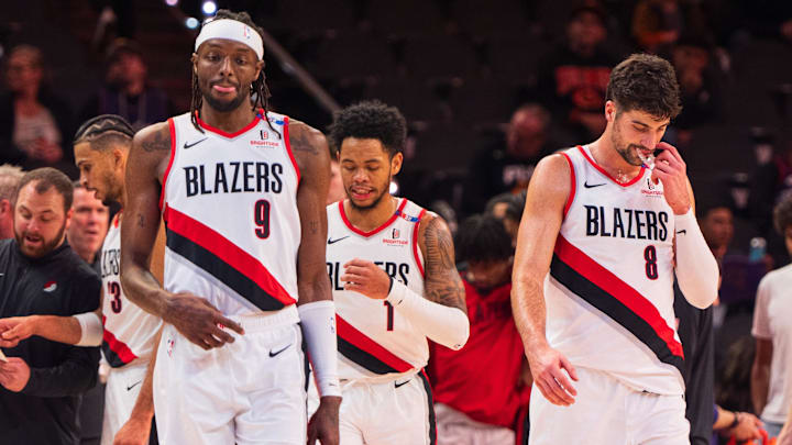 Dec 15, 2024; Phoenix, Arizona, USA: Portland Trail Blazers forward Jerami Grant (9), guard Anfernee Simons (1) and forward Deni Avdija (8) return to the court after a time out in the second half during a game against the Phoenix Suns at Footprint Center. Mandatory Credit: Allan Henry-Imagn Images Dec 15, 2024; Phoenix, Arizona, USA: Portland Trail Blazers forward Jerami Grant (9), guard Anfernee Simons (1) and forward Deni Avdija (8) return to the court after a time out in the second half during a game against the Phoenix Suns at Footprint Center. Mandatory Credit: Allan Henry-Imagn Images