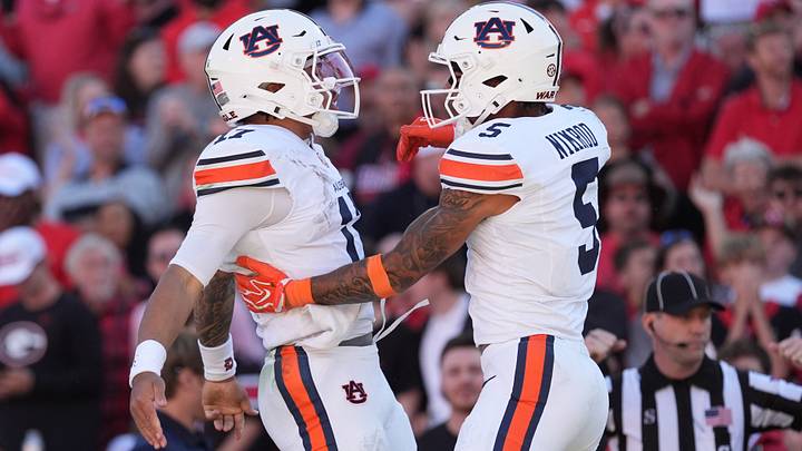 Oct 17, 2026; Athens, Georgia, USA;  Auburn quarterback Byrum Brown (17) and wide receiver Chas Nimrod (5) celebrate a touchdown during the second quarter against Georgia at Sanford Stadium.  Mandatory Credit: Dale Zanine-Imagn Images