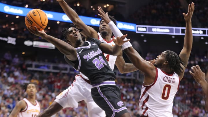 Kansas State junior forward Arthur Kaluma (24) looks for a shot around Iowa State in the first half of the quarterfinal round in the Big 12 Tournament inside the T-Mobile Center in Kansas City, Mo.
