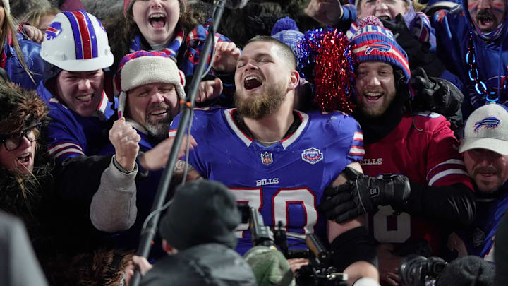 Buffalo Bills offensive tackle Alec Anderson jumps into the fans and sits with them after the game and while a video of game memories at Highmark Stadium played on the jumbotron.