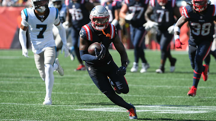 Sep 28, 2025; Foxborough, Massachusetts, USA; New England Patriots wide receiver Stefon Diggs (8) runs with the ball during the second half against the Carolina Panthers at Gillette Stadium. Mandatory Credit: Bob DeChiara-Imagn Images