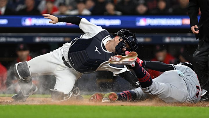 Oct 10, 2024; Detroit, Michigan, USA; Cleveland Guardians shortstop Brayan Rocchio slides in safely in to home plate above the tag from Detroit Tigers catcher Jake Rogers. Oct 10, 2024; Detroit, Michigan, USA; Cleveland Guardians shortstop Brayan Rocchio slides in safely in to home plate above the tag from Detroit Tigers catcher Jake Rogers.