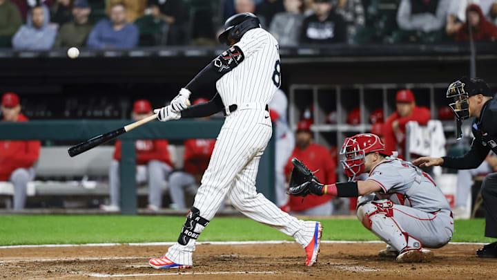 Sep 24, 2024; Chicago, Illinois, USA; Chicago White Sox outfielder Luis Robert Jr. (88) hits an RBI-single against the Los Angeles Angels during the eight inning at Guaranteed Rate Field. Mandatory Credit: Kamil Krzaczynski-Imagn Images