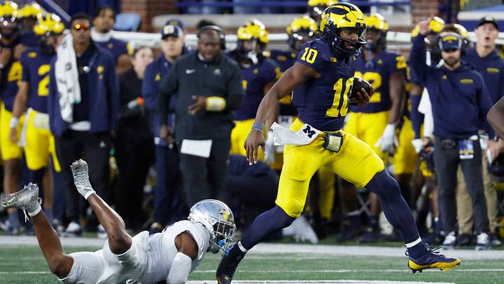 Michigan Wolverines quarterback Alex Orji rushes in the second half against the Oregon Ducks Michigan Wolverines quarterback Alex Orji rushes in the second half against the Oregon Ducks