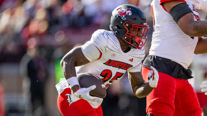 Nov 16, 2024; Stanford, California, USA;  Louisville Cardinals running back Isaac Brown (25) runs the ball during the first quarter against the Stanford Cardinal at Stanford Stadium. Mandatory Credit: Bob Kupbens-Imagn Images