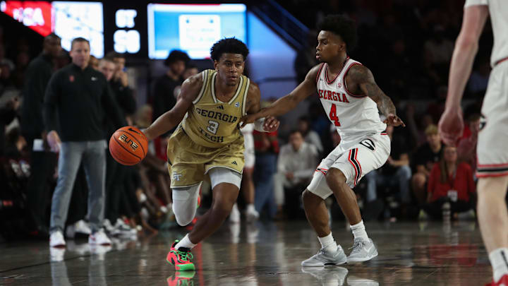 Nov 14, 2025; Athens, Georgia, USA; Georgia Tech Yellow Jackets guard Jaeden Mustaf (3) dribbles past Georgia Bulldogs guard Marcus Millender (4) during the second half at Stegeman Coliseum. Mandatory Credit: Mady Mertens-Imagn Images Nov 14, 2025; Athens, Georgia, USA; Georgia Tech Yellow Jackets guard Jaeden Mustaf (3) dribbles past Georgia Bulldogs guard Marcus Millender (4) during the second half at Stegeman Coliseum. Mandatory Credit: Mady Mertens-Imagn Images