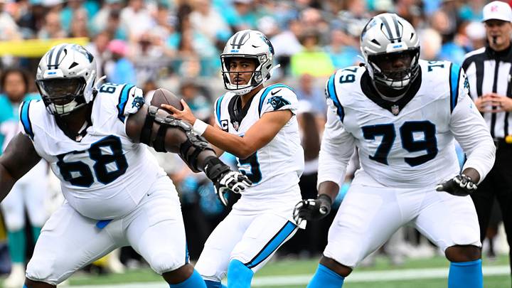 Carolina Panthers quarterback Bryce Young (9) with the ball as guard Damien Lewis (68) and offensive tackle Ikem Ekwonu (79) block