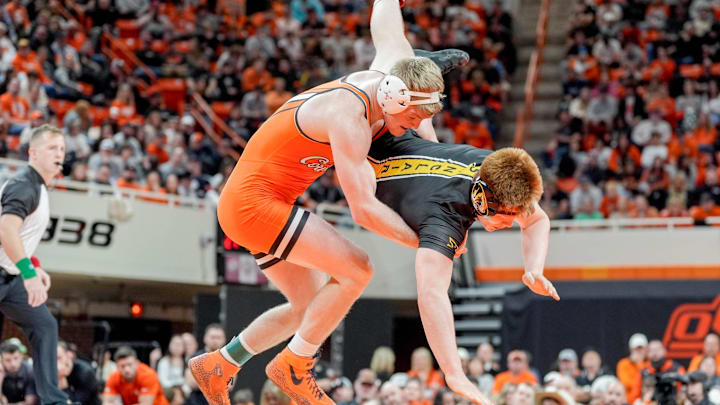Oklahoma State’s Dustin Plott takes down Missouri’s Aeoden Sinclair during an NCAA wrestling meet between Oklahoma State and Missouri at Gallagher-Iba Arena in Stillwater, Okla., on Sunday, Feb. 2, 2025.