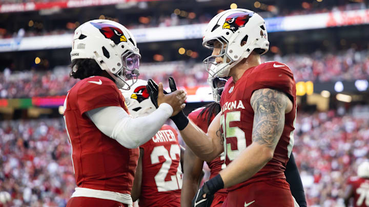 Jan 5, 2025; Glendale, Arizona, USA; Arizona Cardinals quarterback Kyler Murray (1) celebrates a touchdown with tight end Trey McBride (85) against the San Francisco 49ers at State Farm Stadium. Mandatory Credit: Mark J. Rebilas-Imagn Images
