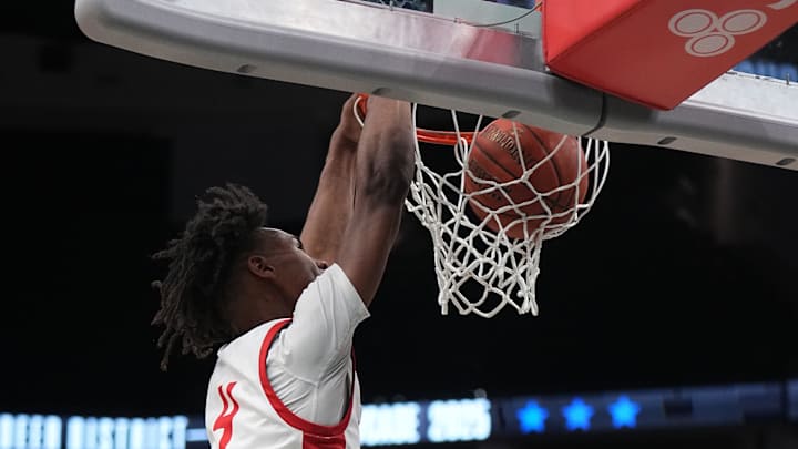 Sun Prairie East's Chris Davis Jr. (4) dunks during a Deer District Prep Showcase game against Stevens Point at Fiserv Forum in Milwaukee, WI. on Saturday, Feb. 8, 2025