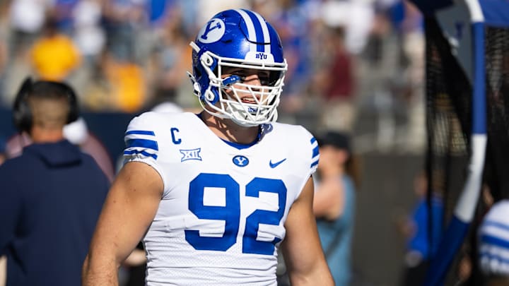 Nov 23, 2024; Tempe, Arizona, USA; Brigham Young Cougars defensive end Tyler Batty (92) against the Arizona State Sun Devils at Mountain America Stadium. Mandatory Credit: Mark J. Rebilas-Imagn Images