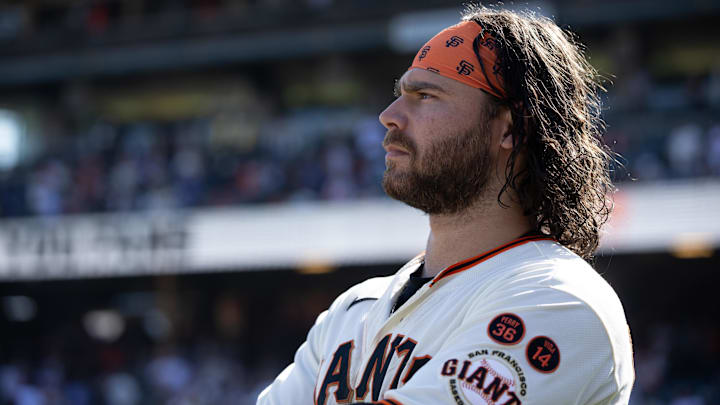 Oct 1, 2023; San Francisco, California, USA; San Francisco Giants shortstop Brandon Crawford watches a tape of season highlights following the final game of the season, against the Los Angeles Dodgers, at Oracle Park Oct 1, 2023; San Francisco, California, USA; San Francisco Giants shortstop Brandon Crawford watches a tape of season highlights following the final game of the season, against the Los Angeles Dodgers, at Oracle Park