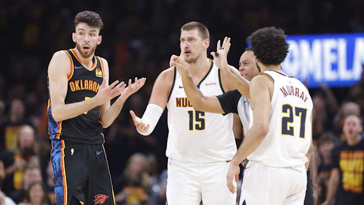 May 5, 2025; Oklahoma City, Oklahoma, USA; Oklahoma City Thunder forward Chet Holmgren (7) and Denver Nuggets center Nikola Jokic (15) react to a play during the second half in game one of the second round for the 2025 NBA Playoffs at Paycom Center.