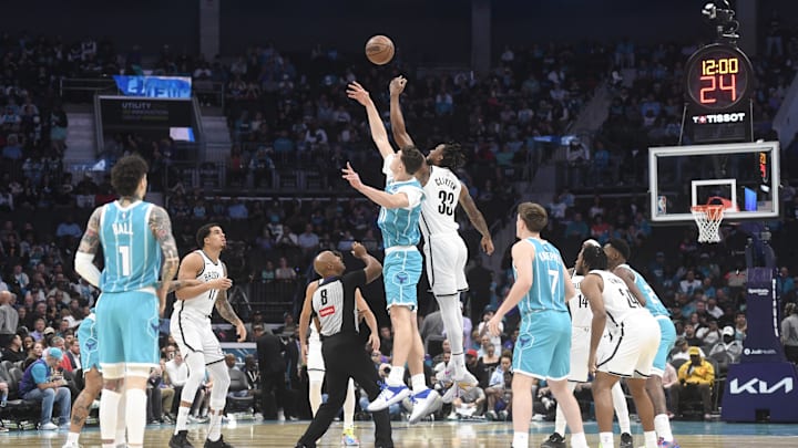 Oct 22, 2025; Charlotte, North Carolina, USA; Charlotte Hornets center Ryan Kalkbrenner (11) and Brooklyn Nets center Nic Claxton (33) tip off the game at the Spectrum Center. Mandatory Credit: Sam Sharpe-Imagn Images Oct 22, 2025; Charlotte, North Carolina, USA; Charlotte Hornets center Ryan Kalkbrenner (11) and Brooklyn Nets center Nic Claxton (33) tip off the game at the Spectrum Center. Mandatory Credit: Sam Sharpe-Imagn Images
