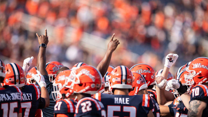 Dec 31, 2024; Orlando, FL, USA;  The Illinois Fighting Illini huddle up before the game against the South Carolina Gamecocks at Camping World Stadium. Mandatory Credit: Jeremy Reper-Imagn Images