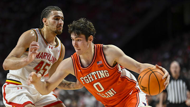 Mar 8, 2026; College Park, Maryland, USA;  Illinois Fighting Illini forward David Mirkovic (0) drives to the basket on Maryland Terrapins center Collin Metcalf (45) during the first half at Xfinity Center. Mandatory Credit: Tommy Gilligan-Imagn Images