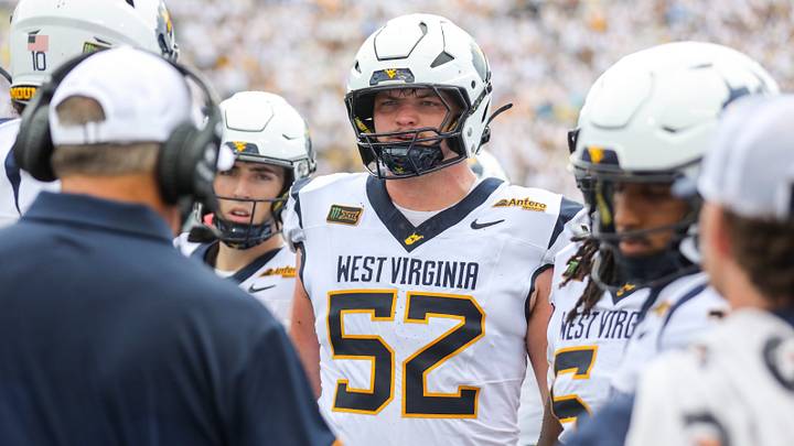 Sep 5, 2026; Morgantown, West Virginia, USA; West Virginia Mountaineers offensive lineman Nick Krahe (52) during a huddle during the second quarter against the Coastal Carolina Chanticleers at Milan Puskar Stadium. Mandatory Credit: Ben Queen-Imagn Images Sep 5, 2026; Morgantown, West Virginia, USA; West Virginia Mountaineers offensive lineman Nick Krahe (52) during a huddle during the second quarter against the Coastal Carolina Chanticleers at Milan Puskar Stadium. Mandatory Credit: Ben Queen-Imagn Images