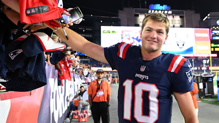 Aug 8, 2025; Foxborough, Massachusetts, USA; New England Patriots quarterback Drake Maye (10) signs autographs after a game against the Washington Commanders during the second half at Gillette Stadium. Mandatory Credit: Brian Fluharty-Imagn Images