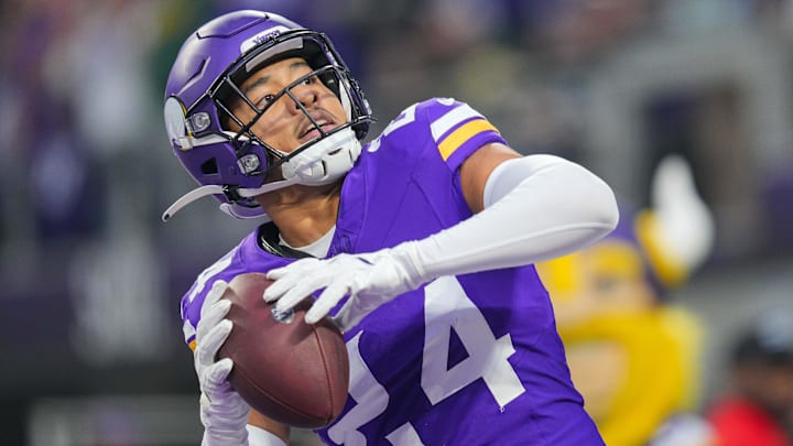 Dec 29, 2024; Minneapolis, Minnesota, USA; Minnesota Vikings safety Camryn Bynum (24) celebrates his fumble recovery against Green Bay Packers in the first quarter at U.S. Bank Stadium. Mandatory Credit: Brad Rempel-Imagn Images