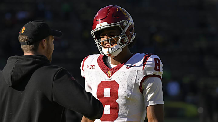Nov 22, 2025; Eugene, Oregon, USA; Southern California Trojans wide receiver Ja'Kobi Lane (8) talks to a coach before the game against the Oregon Ducks at Autzen Stadium. Mandatory Credit: Troy Wayrynen-Imagn Images Nov 22, 2025; Eugene, Oregon, USA; Southern California Trojans wide receiver Ja'Kobi Lane (8) talks to a coach before the game against the Oregon Ducks at Autzen Stadium. Mandatory Credit: Troy Wayrynen-Imagn Images