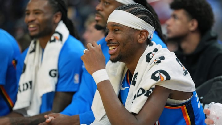 Jan 2, 2026; San Francisco, California, USA; Oklahoma City Thunder guard Shai Gilgeous-Alexander (center) sits on the bench during the second quarter against the Golden State Warriors at Chase Center. Mandatory Credit: Darren Yamashita-Imagn Images