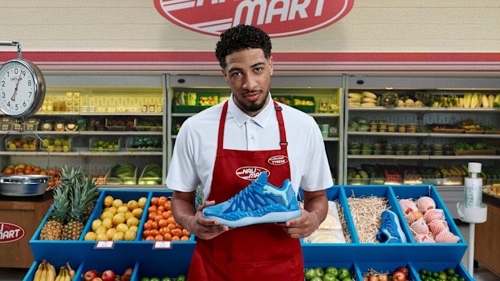 Tyrese Haliburton holds the PUMA Hali 1 'Opal' colorway.