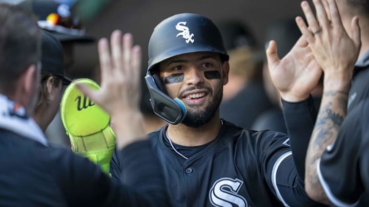 Chicago White Sox catcher Edgar Quero (7) celebrates in the dugout after scoring a run against the Minnesota Twins at Target Field. 