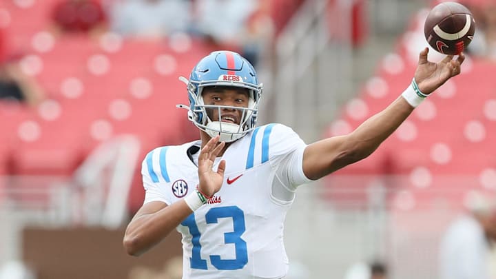 Nov 2, 2024; Fayetteville, Arkansas, USA; Ole Miss Rebels quarterback Austin Simmons (13) during the fourth quarter against the Arkansas Razorbacks at Donald W. Reynolds Razorback Stadium. Mississippi won 63-31. Mandatory Credit: Nelson Chenault-Imagn Images