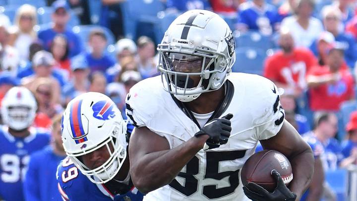 Sep 17, 2023; Orchard Park, New York, USA; Las Vegas Raiders running back Zamir White (35) runs past Buffalo Bills defensive tackle Tim Settle (99) in the fourth quarter at Highmark Stadium. Mandatory Credit: Mark Konezny-USA TODAY Sports Sep 17, 2023; Orchard Park, New York, USA; Las Vegas Raiders running back Zamir White (35) runs past Buffalo Bills defensive tackle Tim Settle (99) in the fourth quarter at Highmark Stadium. Mandatory Credit: Mark Konezny-USA TODAY Sports
