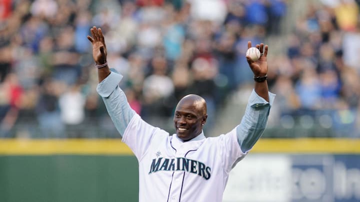 Seattle Mariners former player Mike Cameron throws out the first pitch prior to the game against the Oakland Athletics at Safeco Field. Oakland defeated Seattle 4-0 in 2012.