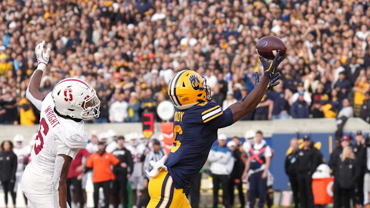 Nov 23, 2024; Berkeley, California, USA; California Golden Bears wide receiver Jonathan Brady (right) catches a touchdown pass against Stanford Cardinal cornerback Collin Wright (left) during the fourth quarter at California Memorial Stadium. Mandatory Credit: Darren Yamashita-Imagn Images