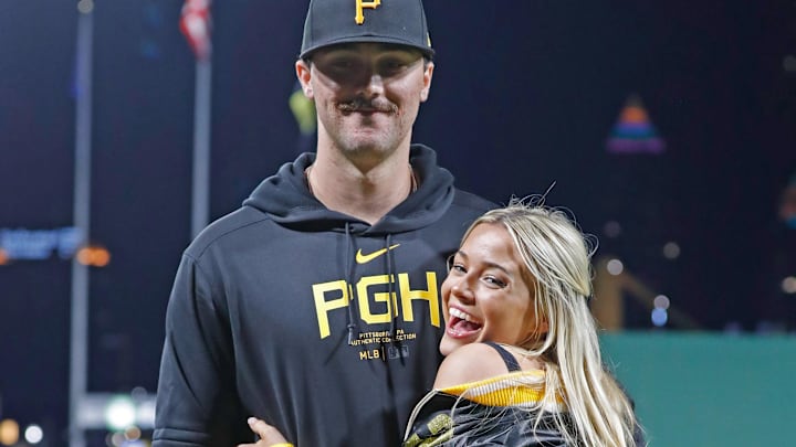 Pittsburgh Pirates starting pitcher Paul Skenes (30) poses with his girlfriend Louisiana State University gymnast Livvy Dunne (right) after Skenes made his major league debut against.