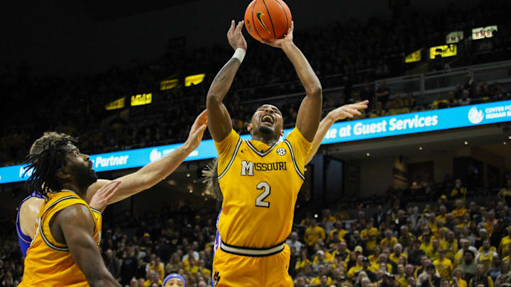 Dec 8, 2024; Columbia, Missouri, USA; Missouri Tigers guard Tamar Bates (2) grimaces while getting a shot up during a game against the Kansas Jayhawks at Mizzou Arena. 