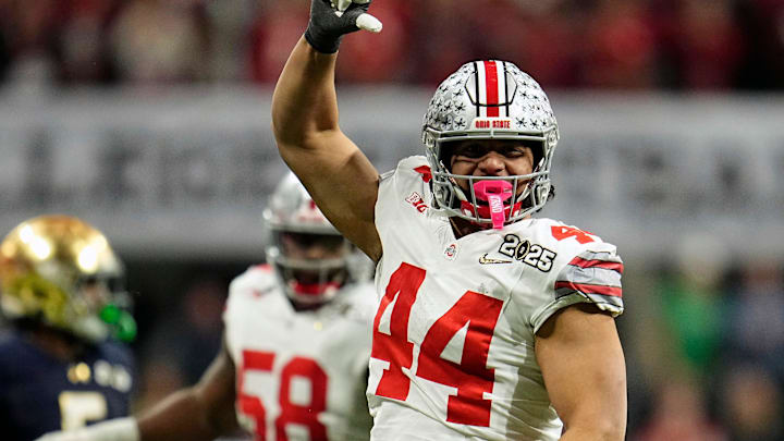 Ohio State Buckeyes defensive end JT Tuimoloau (44) celebrates tackling Notre Dame Fighting Irish quarterback Riley Leonard (13) during the College Football Playoff National Championship at Mercedes-Benz Stadium in Atlanta on January 20, 2025. Ohio State Buckeyes defensive end JT Tuimoloau (44) celebrates tackling Notre Dame Fighting Irish quarterback Riley Leonard (13) during the College Football Playoff National Championship at Mercedes-Benz Stadium in Atlanta on January 20, 2025.